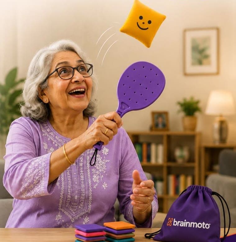 An older woman smiling while playing with a paddle and soft square
